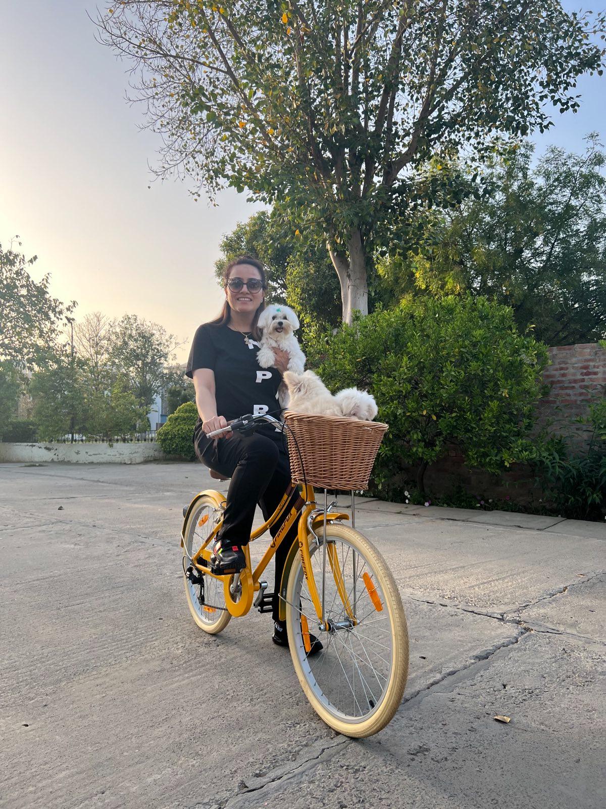 Honeypreet Insan – Riding Bicycle with Pet